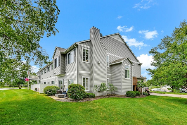 11001 Isanti Ct NE, Blaine, MN 55449 - view of property exterior featuring a yard and a chimney