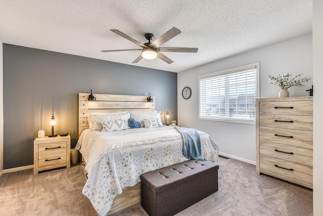 11001 Isanti Ct NE, Blaine, MN 55449 - bedroom featuring carpet floors, a textured ceiling, baseboards, and a ceiling fan