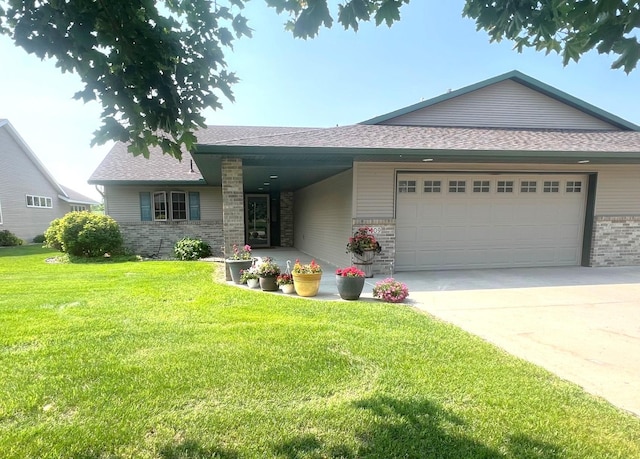 1209 23rd St SE, Willmar, MN 56201 - view of front of property featuring an attached garage, brick siding, a front lawn, concrete driveway, and roof with shingles