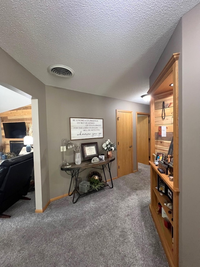1209 23rd St SE, Willmar, MN 56201 - carpeted home office with a textured ceiling and baseboards