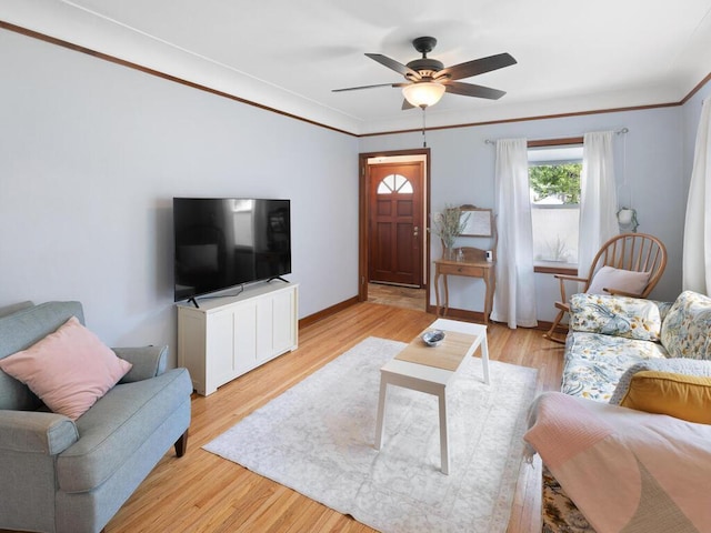 1033 Hall Ave W, Saint Paul, MN 55118 - living area with ceiling fan, light wood finished floors, crown molding, and baseboards