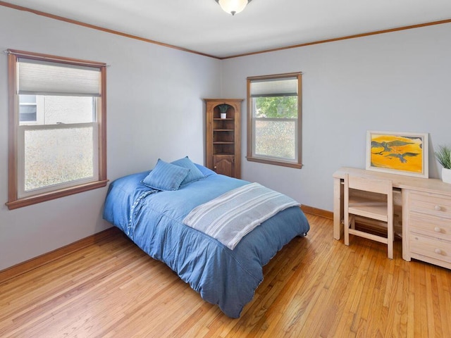 1033 Hall Ave W, Saint Paul, MN 55118 - bedroom featuring light wood finished floors, ornamental molding, and baseboards
