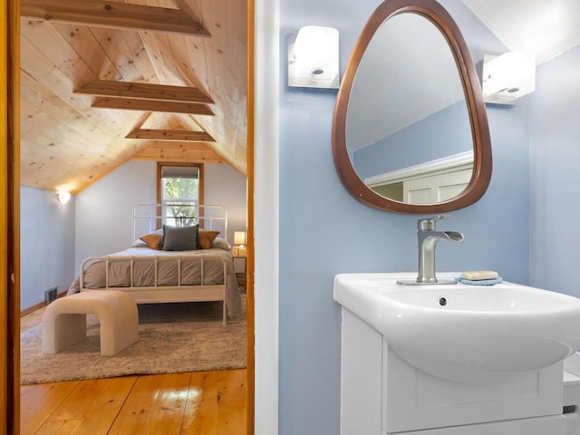 1033 Hall Ave W, Saint Paul, MN 55118 - bedroom with hardwood / wood-style floors, wooden ceiling, and a sink