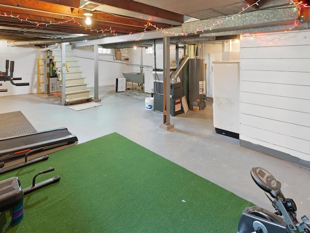 1033 Hall Ave W, Saint Paul, MN 55118 - unfinished below grade area featuring water heater, a sink, and heating unit
