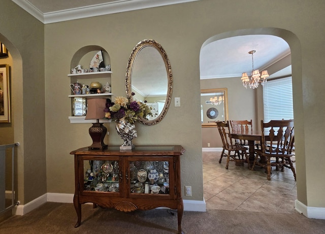 620 5th Ave SE, Pipestone, MN 56164 - hall with arched walkways, crown molding, a chandelier, carpet floors, and baseboards