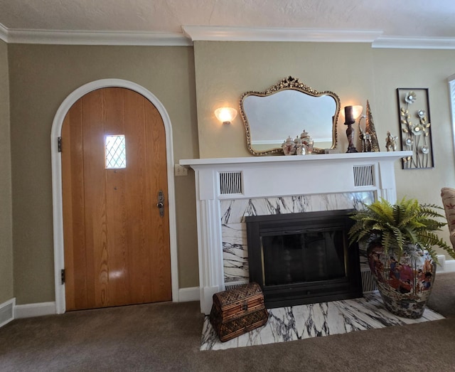 620 5th Ave SE, Pipestone, MN 56164 - living area with carpet flooring, ornamental molding, arched walkways, baseboards, and a premium fireplace