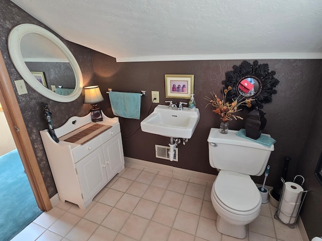 620 5th Ave SE, Pipestone, MN 56164 - bathroom with a sink, tile patterned flooring, and toilet