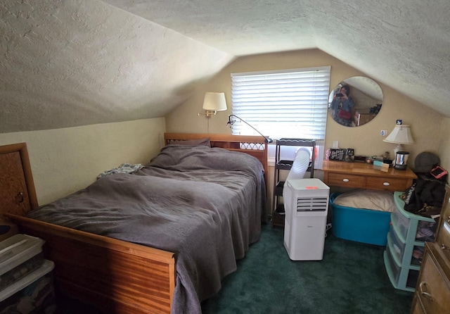620 5th Ave SE, Pipestone, MN 56164 - bedroom featuring a textured ceiling, vaulted ceiling, and carpet flooring