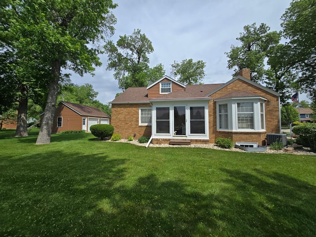 620 5th Ave SE, Pipestone, MN 56164 - rear view of property featuring cooling unit, a lawn, a chimney, and brick siding