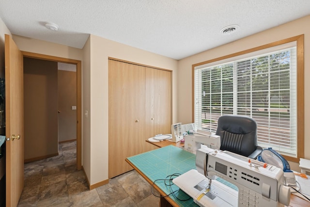 15548 Float Ln Unit 104, Apple Valley, MN 55124 - office featuring stone finish flooring, a textured ceiling, and baseboards