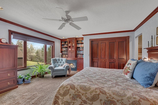 2917 Vonderheide Dr SW, Alexandria, MN 56308 - carpeted bedroom with a glass covered fireplace, ornamental molding, a textured ceiling, a closet, and ceiling fan
