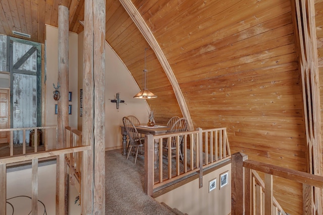 2917 Vonderheide Dr SW, Alexandria, MN 56308 - hallway featuring wooden ceiling, an upstairs landing, carpet, vaulted ceiling, and wood walls