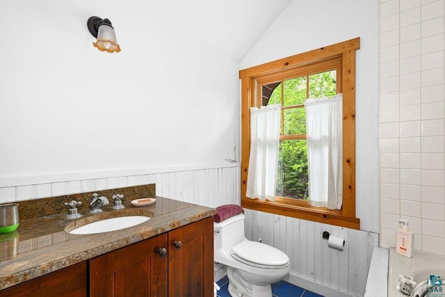 4015 Van Rd, Duluth, MN 55803 - bathroom featuring toilet, lofted ceiling, a wainscoted wall, vanity, and wood walls