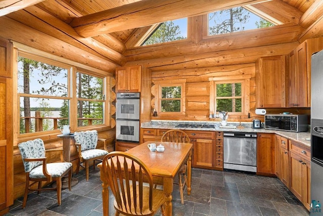 4015 Van Rd, Duluth, MN 55803 - kitchen with appliances with stainless steel finishes, stone tile floors, brown cabinets, wooden ceiling, and light stone countertops
