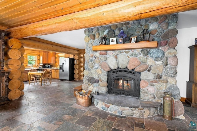 4015 Van Rd, Duluth, MN 55803 - living area with stone tile floors, a fireplace, and rustic walls
