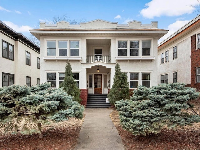 3112 Bryant Ave S Unit 1, Minneapolis, MN 55408 - view of front of house with a balcony and stucco siding