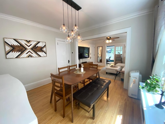 3112 Bryant Ave S Unit 1, Minneapolis, MN 55408 - dining room featuring crown molding, light wood-type flooring, a ceiling fan, and baseboards
