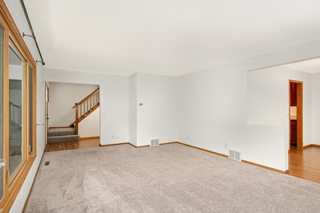 1624 Saint Croix Cir, Golden Valley, MN 55422 - carpeted empty room featuring baseboards and stairway