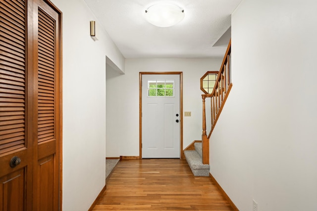 1624 Saint Croix Cir, Golden Valley, MN 55422 - entryway featuring light wood finished floors, stairway, and baseboards