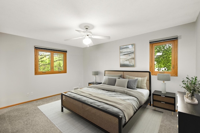 1624 Saint Croix Cir, Golden Valley, MN 55422 - bedroom with multiple windows, light carpet, baseboards, and ceiling fan