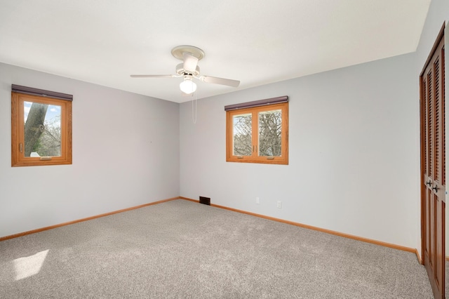 1624 Saint Croix Cir, Golden Valley, MN 55422 - unfurnished bedroom featuring a closet, multiple windows, carpet flooring, and baseboards