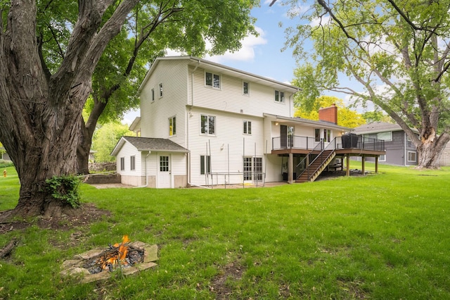 1624 Saint Croix Cir, Golden Valley, MN 55422 - back of property with a wooden deck, an outdoor fire pit, stairway, and a yard