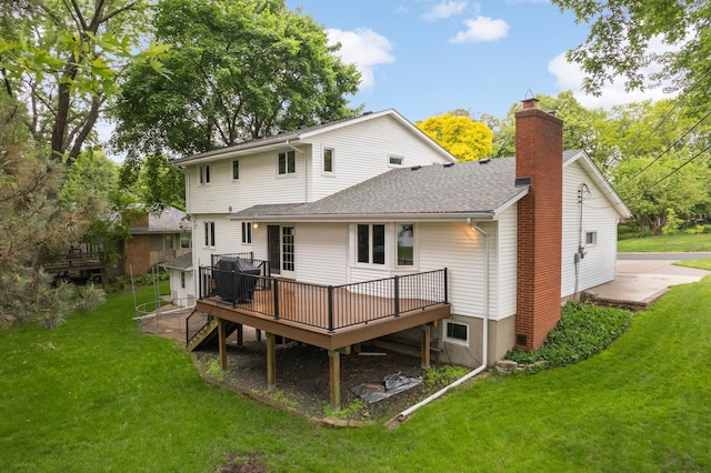 1624 Saint Croix Cir, Golden Valley, MN 55422 - rear view of house with a chimney, a deck, a shingled roof, and a lawn