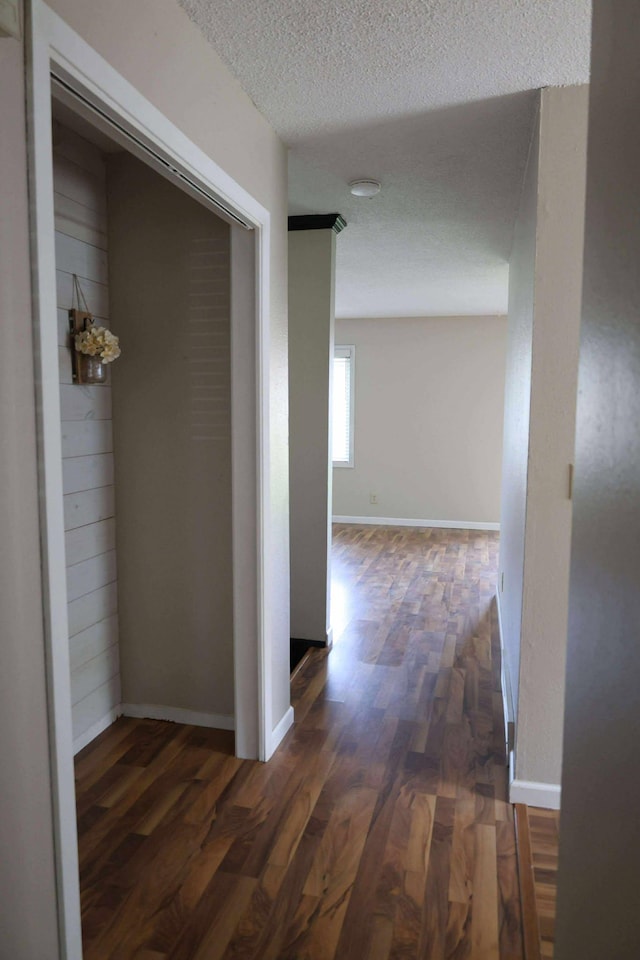 531 5th Street Ct E, West Fargo, ND 58078 - hall with wood finished floors, a textured ceiling, and baseboards