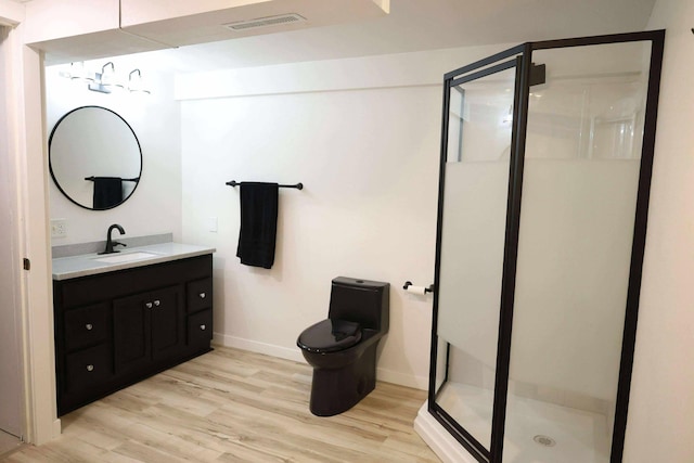531 5th Street Ct E, West Fargo, ND 58078 - bathroom with vanity, wood finished floors, toilet, and baseboards