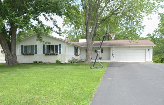 2603 140th Ln NW, Andover, MN 55304 - ranch-style home with a garage, driveway, a chimney, and a front yard