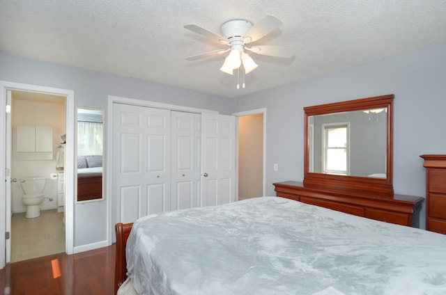 2603 140th Ln NW, Andover, MN 55304 - bedroom featuring a closet, a ceiling fan, ensuite bathroom, wood finished floors, and a textured ceiling