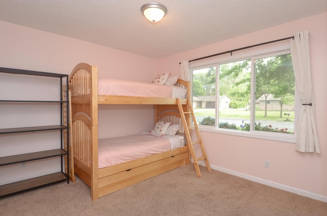 2603 140th Ln NW, Andover, MN 55304 - carpeted bedroom featuring a textured ceiling and baseboards