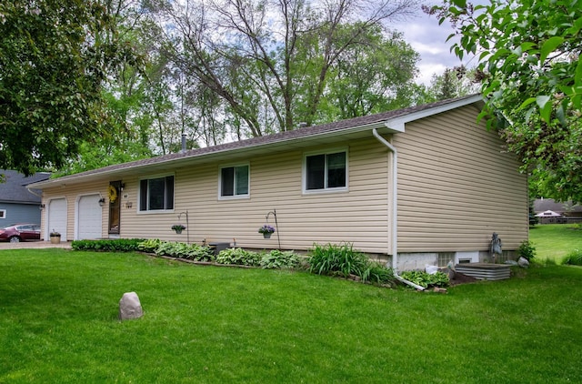 8659 215th St N, Forest Lake, MN 55025 - ranch-style home with a front yard and an attached garage