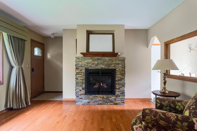 8659 215th St N, Forest Lake, MN 55025 - living room with wood finished floors, a fireplace, and baseboards