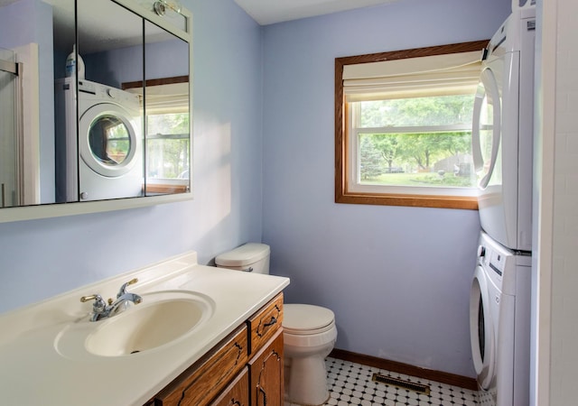 8659 215th St N, Forest Lake, MN 55025 - bathroom with estacked washer and dryer, toilet, plenty of natural light, and vanity