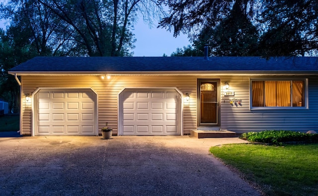8659 215th St N, Forest Lake, MN 55025 - view of front of house featuring concrete driveway, an attached garage, and roof with shingles