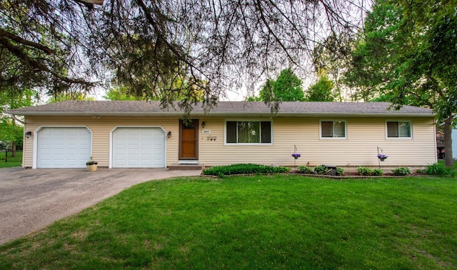 8659 215th St N, Forest Lake, MN 55025 - ranch-style home featuring asphalt driveway, a garage, and a front yard