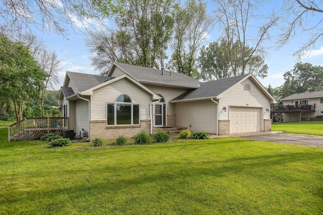 7811 209th St N, Forest Lake, MN 55025 - view of front of home featuring brick siding, an attached garage, asphalt driveway, and a front yard