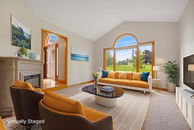7811 209th St N, Forest Lake, MN 55025 - living area featuring plenty of natural light, a glass covered fireplace, and high vaulted ceiling