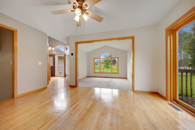 7811 209th St N, Forest Lake, MN 55025 - unfurnished room with wood finished floors, ceiling fan, and lofted ceiling
