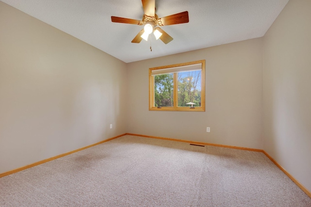 7811 209th St N, Forest Lake, MN 55025 - carpeted spare room with baseboards and ceiling fan