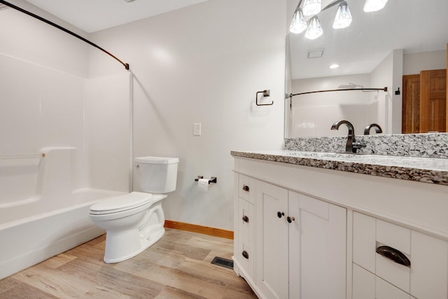 7811 209th St N, Forest Lake, MN 55025 - full bathroom featuring wood finished floors, vanity, and bathtub / shower combination