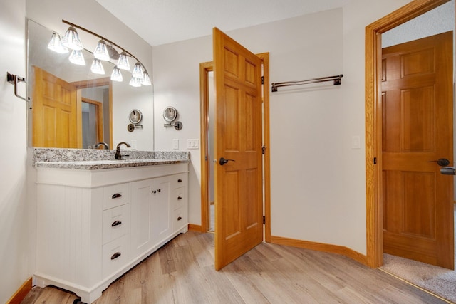 7811 209th St N, Forest Lake, MN 55025 - bathroom featuring wood finished floors and vanity