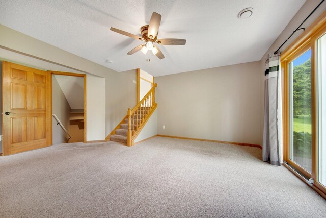 7811 209th St N, Forest Lake, MN 55025 - carpeted spare room featuring ceiling fan and stairway