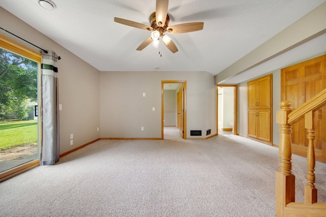 7811 209th St N, Forest Lake, MN 55025 - empty room with light colored carpet, ceiling fan, and stairway