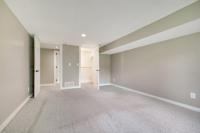7811 209th St N, Forest Lake, MN 55025 - spare room featuring light colored carpet and recessed lighting