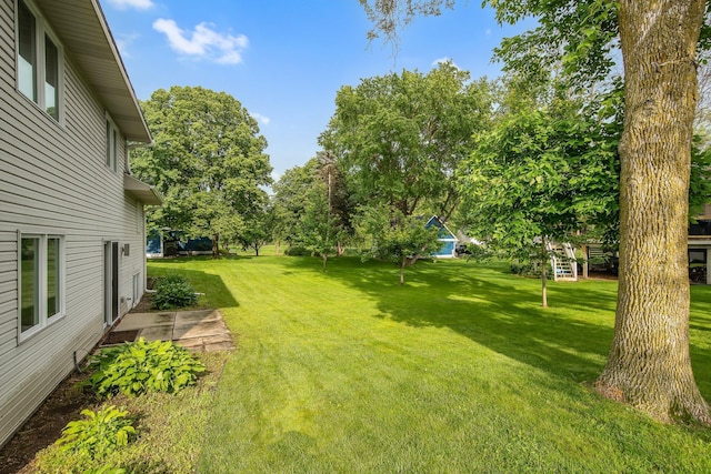 7811 209th St N, Forest Lake, MN 55025 - view of green lawn featuring view of scattered trees