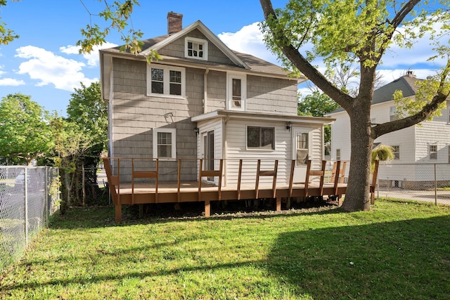 308 4th Ave SW, Austin, MN 55912 - rear view of property featuring a wooden deck and a chimney