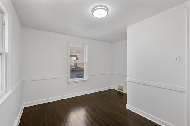 308 4th Ave SW, Austin, MN 55912 - unfurnished room featuring dark wood-style floors and baseboards