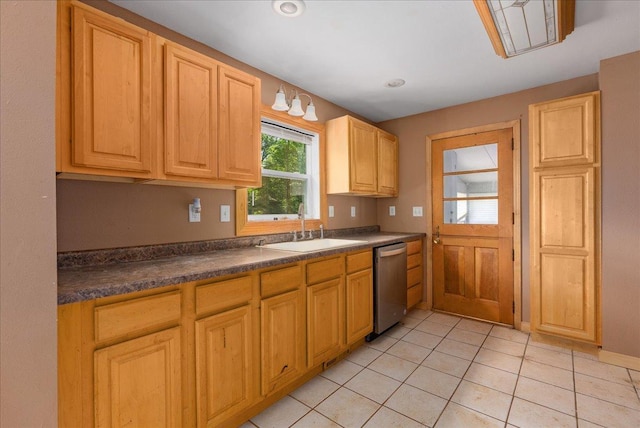 950 Clark St, Hammond, WI 54015 - kitchen with dishwasher, a sink, dark countertops, and light tile patterned floors